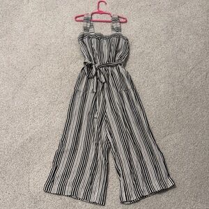 Striped Black and Cream colored Bebe girls Jumpsuit